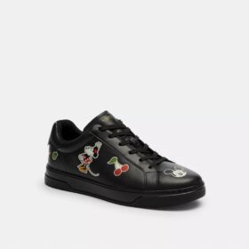 Baskets montantes Disney x Coach avec imprimé autocollant