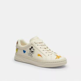 Baskets montantes Disney x Coach avec imprimé autocollant
