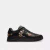 Baskets montantes Disney x Coach avec imprimé autocollant