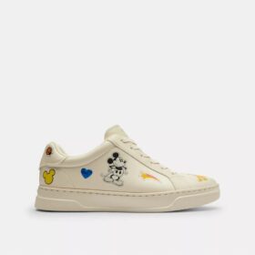 Baskets montantes Disney x Coach avec imprimé autocollant