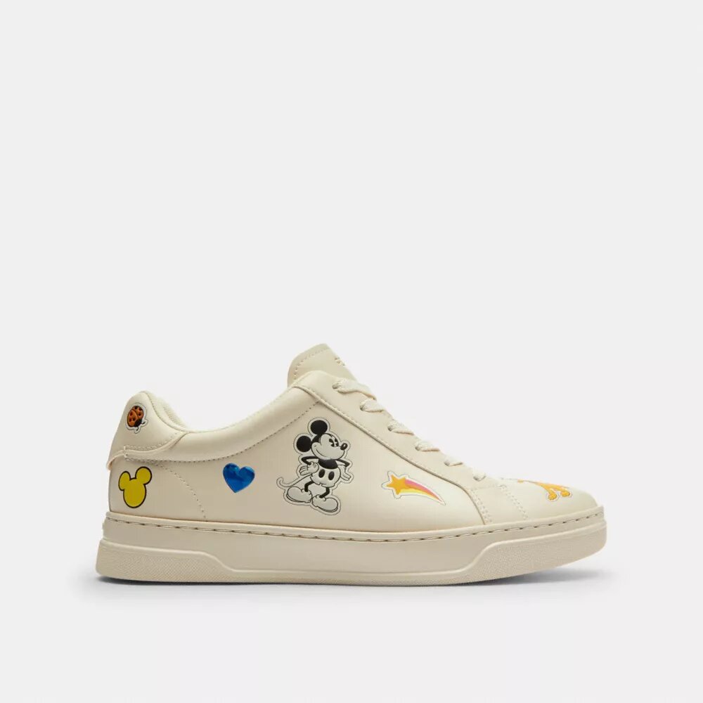 Baskets montantes Disney x Coach avec imprimé autocollant