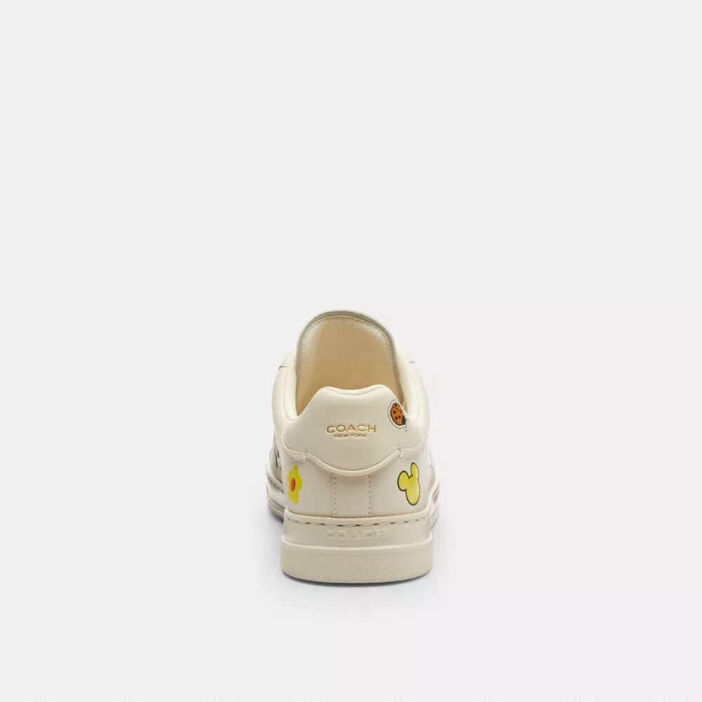 Baskets montantes Disney x Coach avec imprimé autocollant