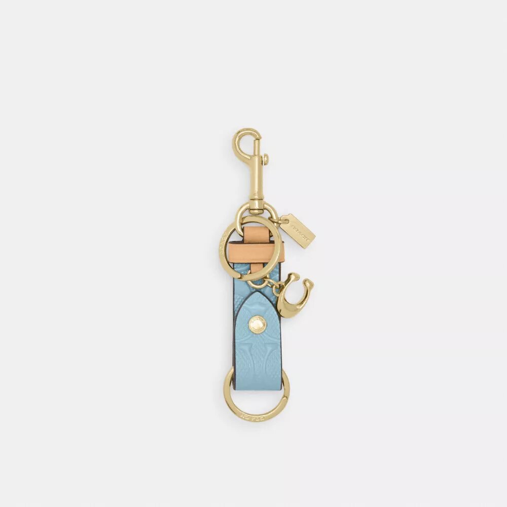 Bijou de sac « Trigger Snap » en cuir emblématique avec pendentif