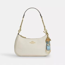 Bijou de sac « Trigger Snap » en cuir emblématique avec pendentif