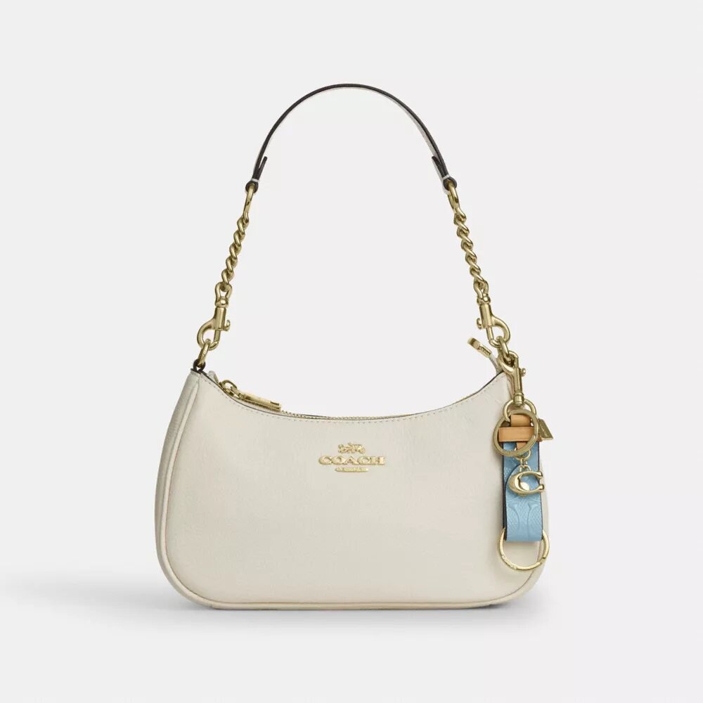 Bijou de sac « Trigger Snap » en cuir emblématique avec pendentif