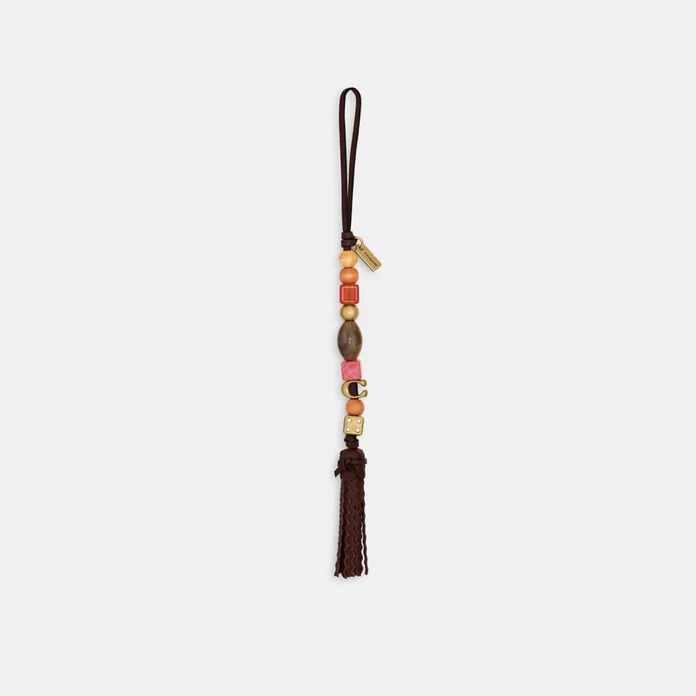 Bijoux de sac à pompon et perles
