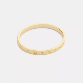 Bracelet à charnières avec motif « C » répété
