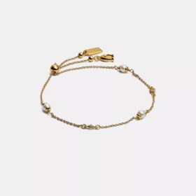 Bracelet coulissant avec perles en forme de C sculptées