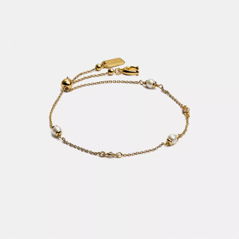 Bracelet coulissant avec perles en forme de C sculptées