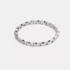Bracelet rigide à charnière avec chaîne emblématique