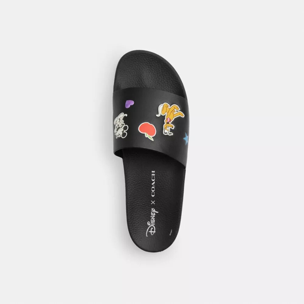 Claquettes Disney x Coach avec imprimé autocollant