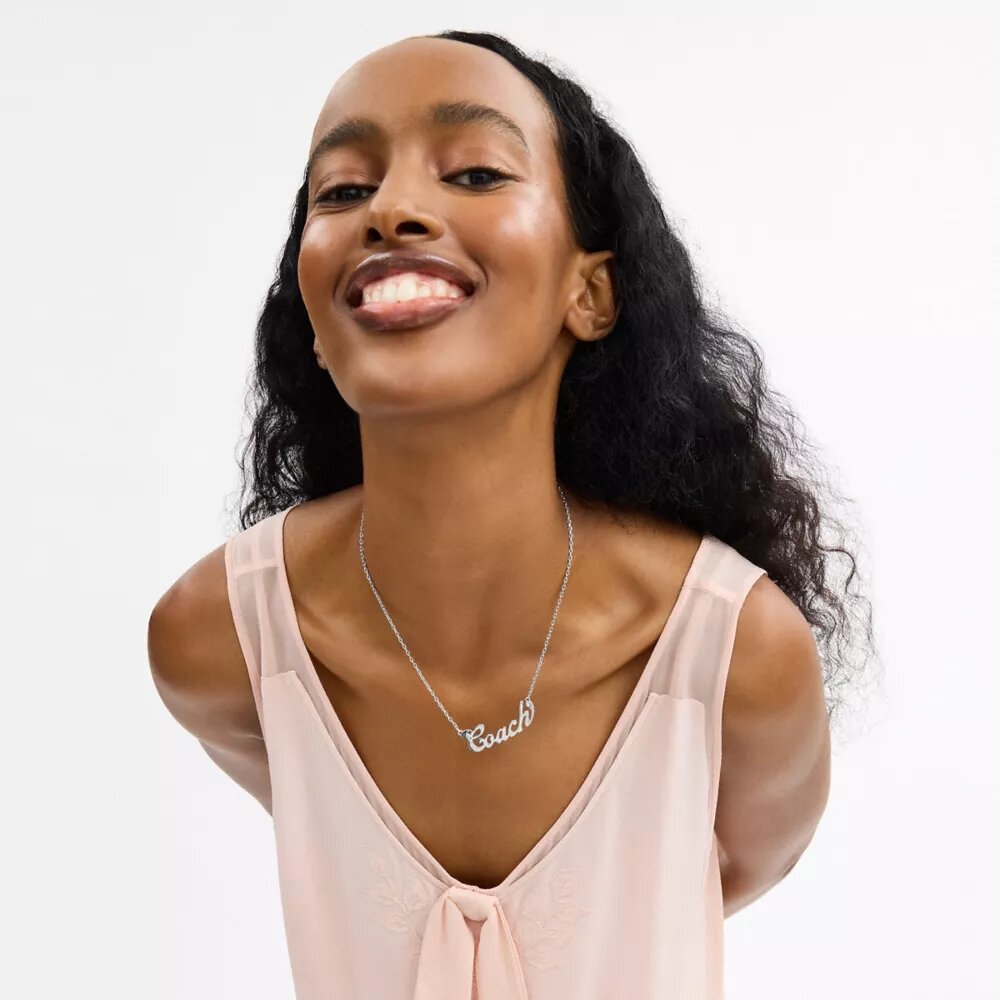 Collier avec plaque nominative « Coach Script »