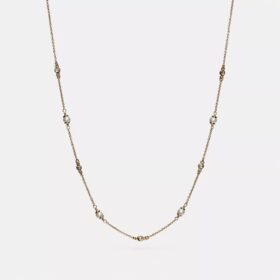 Collier de perles sculptées en forme de C