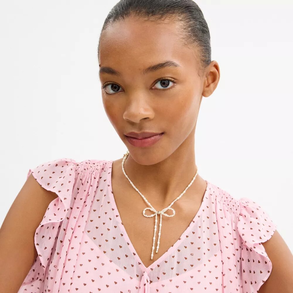 Collier ras-du-cou à nœud en perles