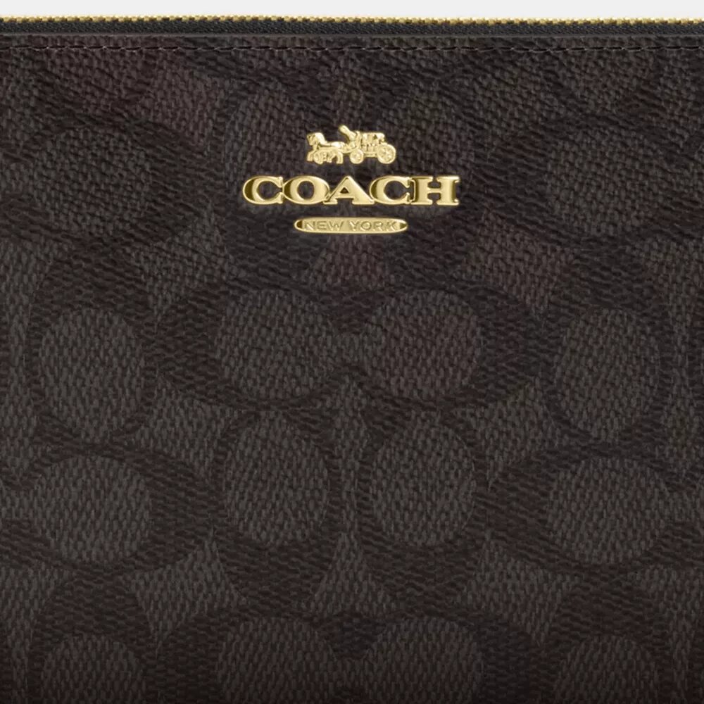 Grande pochette dragonne à fermeture éclair d'angle en Signature Canvas