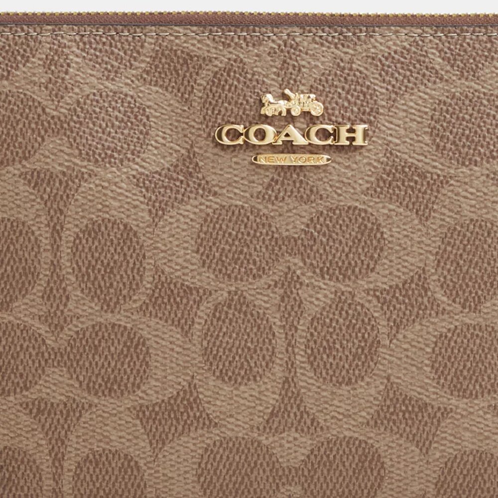 Grande pochette dragonne à fermeture éclair d'angle en Signature Canvas