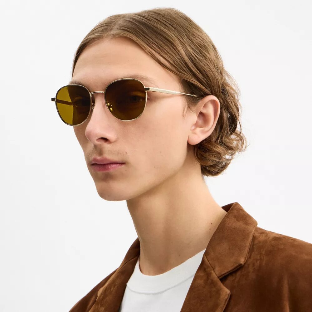 Lunettes de soleil rondes avec étiquette métallique