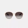 Lunettes de soleil rondes en métal avec monture C