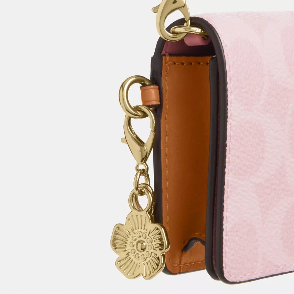 Mini-portefeuille à chaîne en Signature Canvas avec Charms
