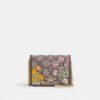 Mini-portefeuille sur chaîne en jacquard signature avec broderie florale