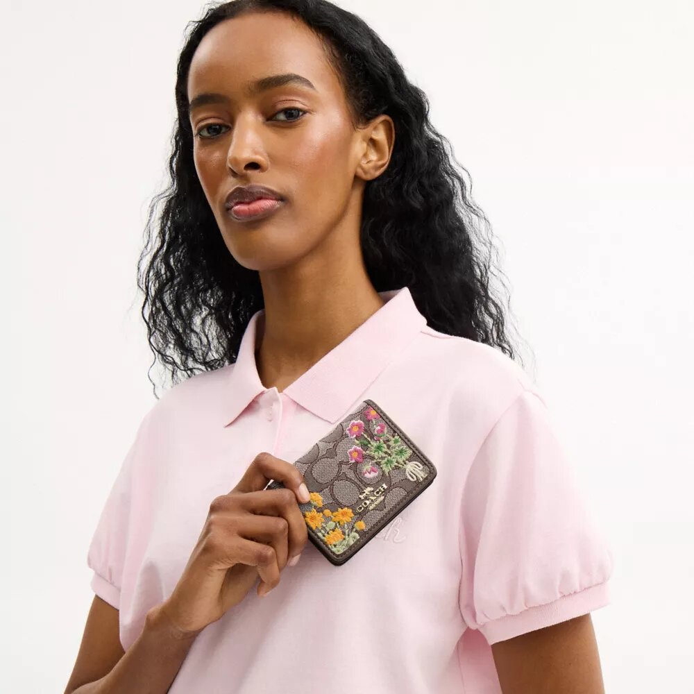 Mini-portefeuille sur chaîne en jacquard signature avec broderie florale