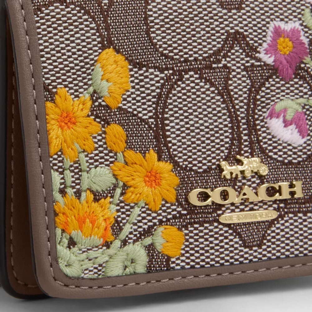 Mini-portefeuille sur chaîne en jacquard signature avec broderie florale