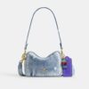 Mini sac bandoulière Carey en denim « Loved » avec Charms