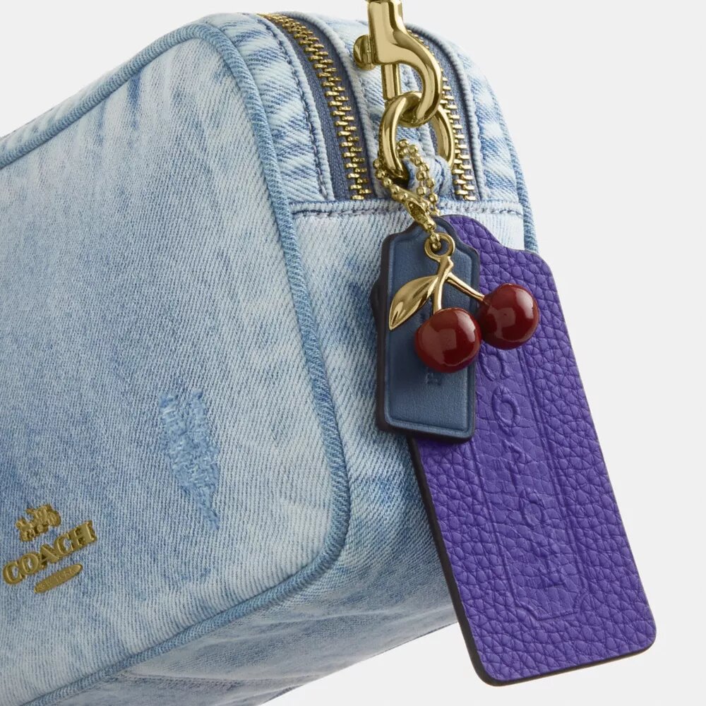 Mini sac bandoulière Carey en denim « Loved » avec Charms
