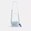 Mini sac bandoulière Carey en denim « Loved » avec Charms