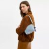 Mini sac bandoulière Carey en denim « Loved » avec Charms