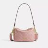 Mini sac bandoulière Carey en denim Signature