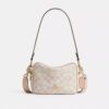 Mini sac bandoulière Carey en Signature Canvas