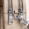 Mini sac bandoulière Carey en Signature Canvas
