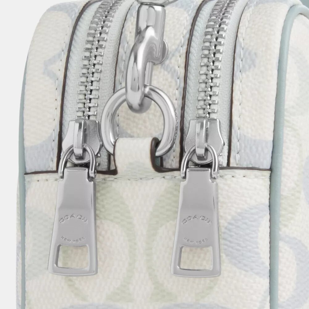 Mini sac bandoulière Carey en Signature Canvas