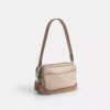 Mini sac bandoulière Carey en Signature Canvas