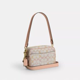 Mini sac bandoulière Carey en Signature Canvas