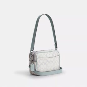 Mini sac bandoulière Carey en Signature Canvas