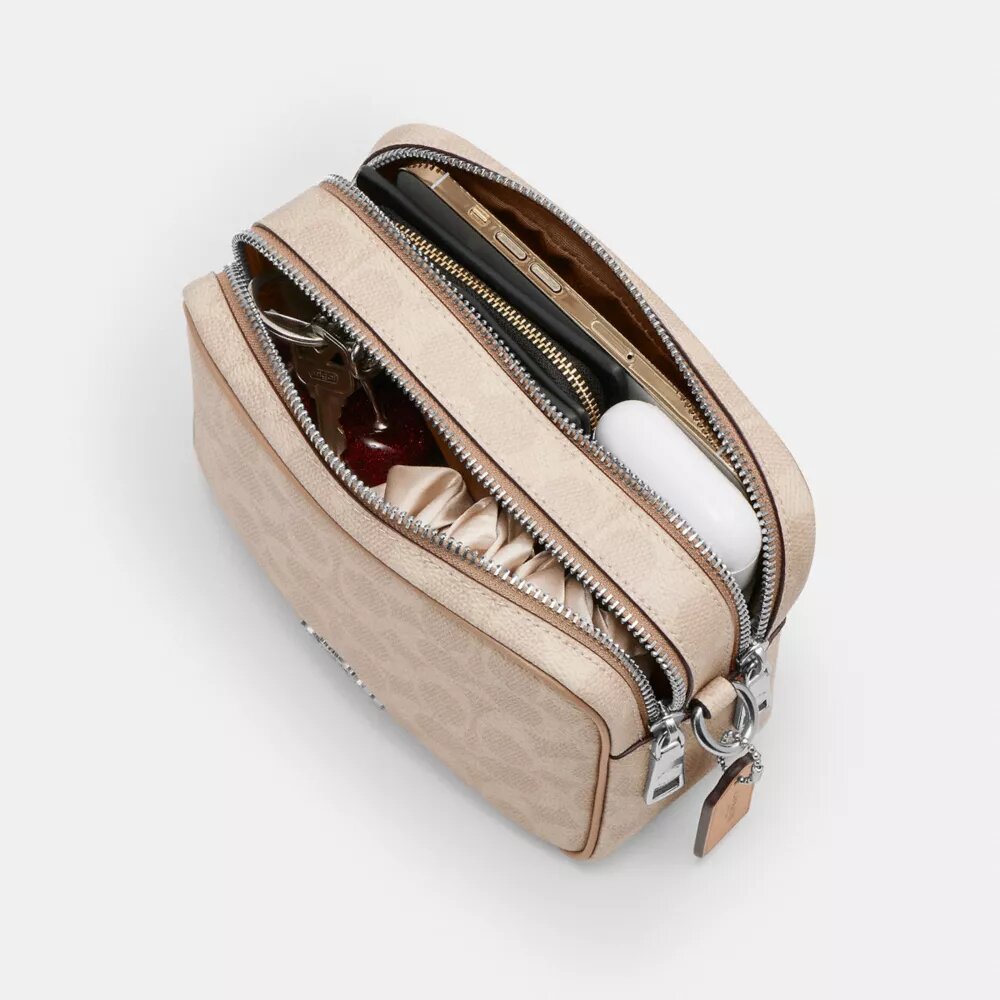 Mini sac bandoulière Carey en Signature Canvas
