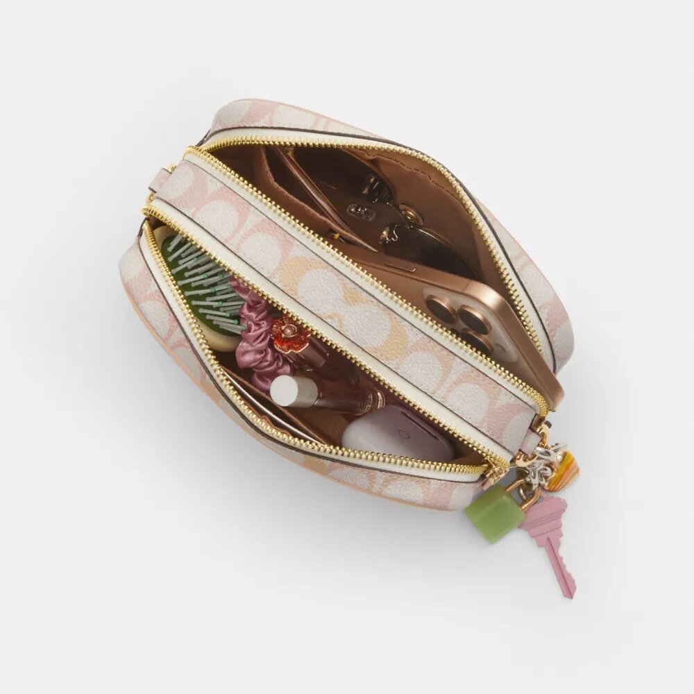 Mini sac bandoulière Carey en Signature Canvas