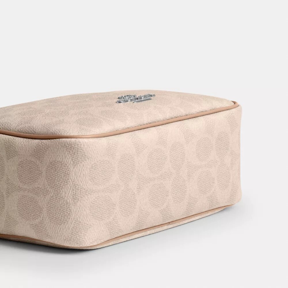 Mini sac bandoulière Carey en Signature Canvas