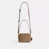 Mini sac bandoulière Carey en Signature Canvas