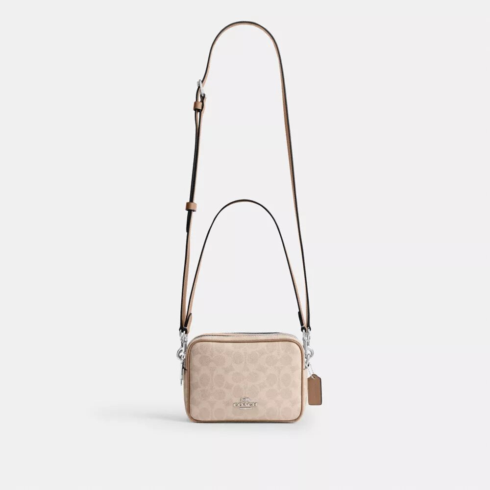Mini sac bandoulière Carey en Signature Canvas