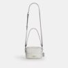 Mini sac bandoulière Carey en Signature Canvas
