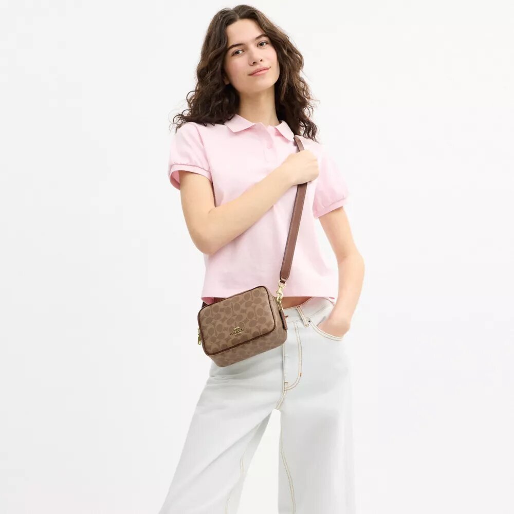 Mini sac bandoulière Carey en Signature Canvas