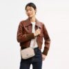 Mini sac bandoulière Carey en Signature Canvas