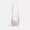 Mini sac bandoulière Carey en Signature Canvas
