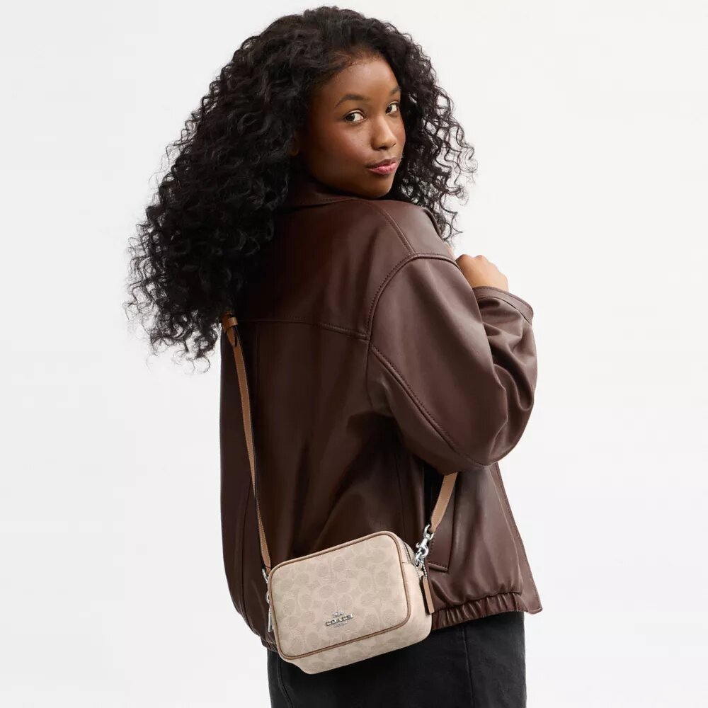 Mini sac bandoulière Carey en Signature Canvas