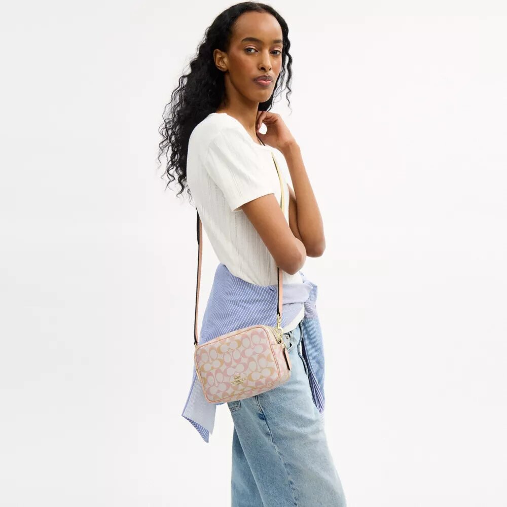 Mini sac bandoulière Carey en Signature Canvas