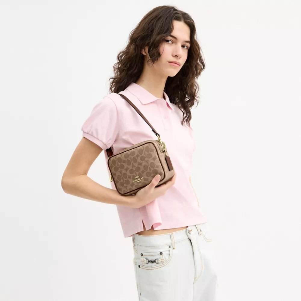 Mini sac bandoulière Carey en Signature Canvas