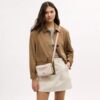 Mini sac bandoulière Carey en Signature Canvas